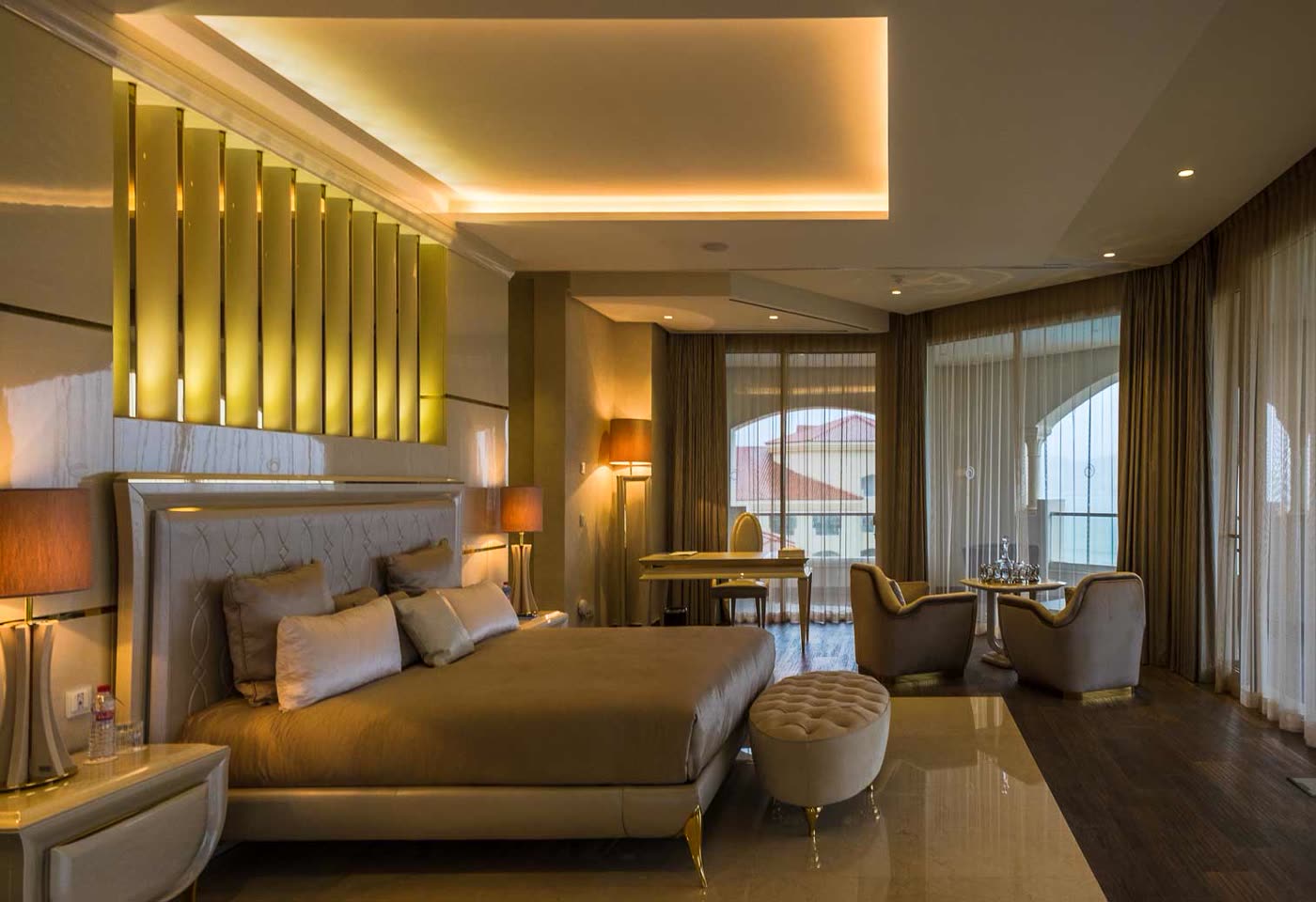 Hotel suite with a king bed and a private terrace
