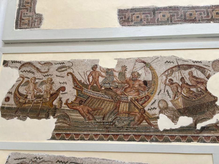 A Roman mosaic of a boat and figures at the Bardo