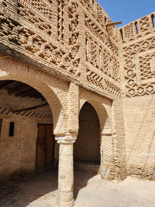 A courtyard of carved traditional brickwork